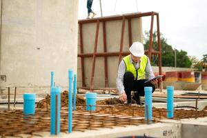Engineers supervise construction work and inspect the foundation work of residential buildings,10 photo