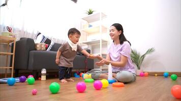 While in vacation at home, a mother engages in activities with little kid,341 photo