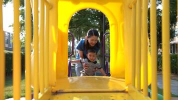 While in vacation at home, a mother engages in activities with little kid in the park,320 photo