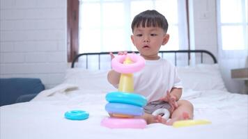 Before putting the kids to bed, kid unwind and play with toy in the bedroom,308 photo