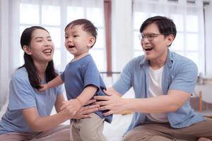 Asian kid and parents enjoying are having fun applying cream, powder and dressing up,63 photo
