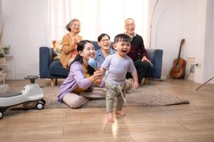 Happy multi-generational Asian family enjoying quality time together at home,44 photo