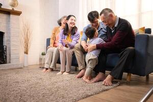 Happy multi-generational Asian family enjoying quality time together at home,21 photo
