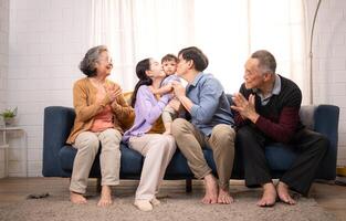 Happy multi-generational Asian family enjoying quality time together at home,18 photo