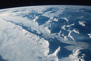 Frozen mountains casting long shadows on a snow covered landscape photo