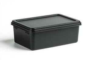 Black plastic storage container with lid on white background photo