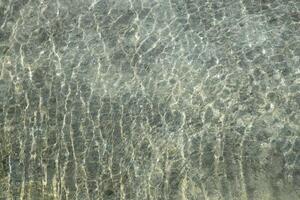 Water surface, abstract background. Beautiful Clear Water with ripples. Top view photo
