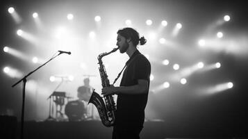 Saxophonist on Stage at Night photo