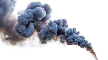A large plume of dark gray smoke rising against a bright white background in the sky above photo