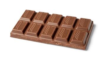 Close up shot of a milk chocolate bar with rectangular segments on a white background surface photo