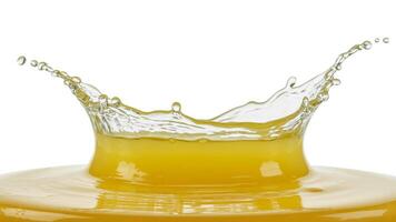 Close up shot of a splash of vibrant orange liquid against a stark white background scene photo