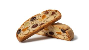 Close up of two biscotti slices with almonds and dried fruit on a white surface photo