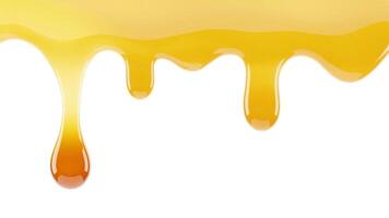A close up view of dripping golden liquid with a smooth and glossy texture on white backdrop photo