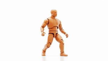A wooden mannequin standing in a dynamic pose on a bright white surface with soft shadows photo