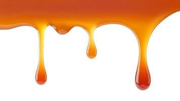 A close up of caramel dripping down with a white background and smooth texture visible photo