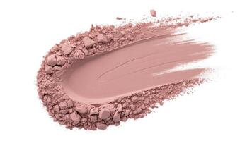 A close up shot of a pinkish powder makeup smear on a white background in studio light photo