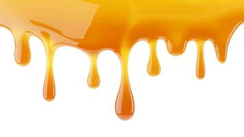 Close up of dripping caramel sauce with a glossy texture against white background photo