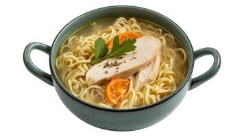 A bowl of chicken noodle soup with parsley and tomato slices on a white background view from top photo