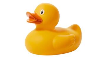 A bright yellow rubber duck with an orange beak isolated on a plain white background surface photo