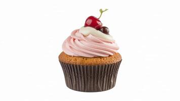 A close up of a cupcake with pink frosting and a cherry on top on white background photo