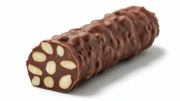 Close up of a chocolate log with almonds visible on a white surface in studio lighting photo