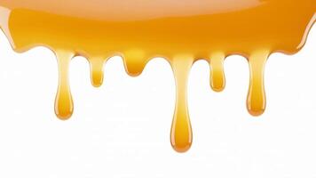 Close up of caramel dripping down a white surface, showing a sweet and sticky treat photo
