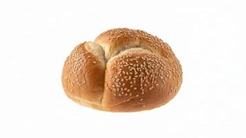 Close up shot of a single kaiser roll with sesame seeds on a white background photo