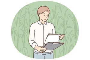 Man farmer inspecting corncobs standing in field with clipboard and working in agribusiness vector
