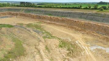 Drone shot of industrial quarry extraction of minerals and materials in England UK video