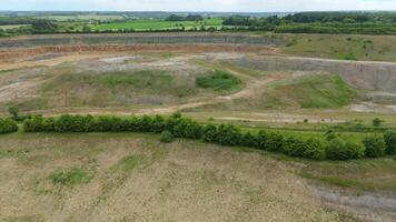 Aerial drone view of mining pit quarry for aggregates and rare earth minerals in England UK video
