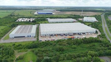 Aerial view of business park factory units and quantum computing UK video