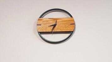 Time lapse footage of the time passing on the stylish modern wall clock. Concept video