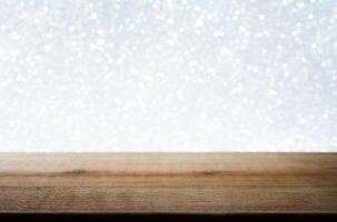 Wooden Table with White Bokeh Background. Festive Light Backdrop. Stock photo. photo