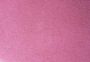 Pink textured surface with rough grain, ideal as a background for creative projects, posters, design templates, or digital graphics with copy space. photo