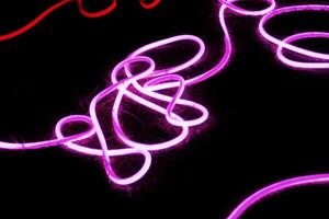 a vibrant and abstract composition of neon lights photo