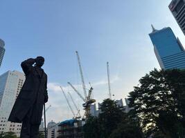 Jakarta, Indonesia, 2025 - The General Sudirman statue is one of the statues in the Dukuh Atas area, in front of the BNI Building, Jalan Jenderal Sudirman. Monument, statue national hero photo