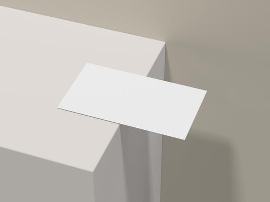 Minimalist business card mockup on edge of light beige table