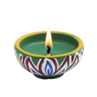 decorative clay diya with vibrant flame, featuring intricate painted patterns in green, yellow, and white, symbolizing warmth and celebration png