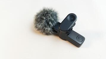 Lavalier wireless microphone isolated on background close up. photo