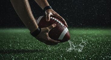 American football on wet grass during heavy rain photo