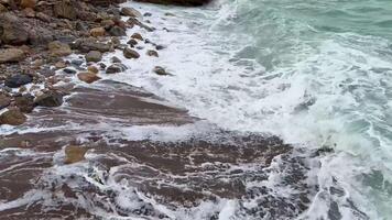 The dynamic ocean waves crashing against the rocky coast create an incredibly serene and picturesque coastal scene photo