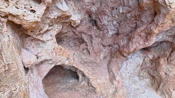 Explore stunning rock textures and geological formations filled with fascinating cavities and intricate patterns photo