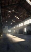 Sunlight streams into a vast empty warehouse space creating an atmosphere of solitude and potential illuminating history photo