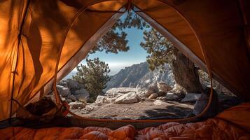 Spectacular mountain vista from within a cozy tent offers an immersive camping experience. photo