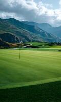 Panoramic vista of a perfectly manicured golf course nestled amongst majestic mountains and cloudy sky photo