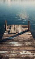 Wooden pier stretching into calm lake waters inviting peaceful contemplation and serene reflection of nature photo
