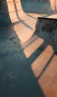 Urban skatepark architecture illuminated by sun creating geometric patterns enhancing raw beauty skateboarding culture photo
