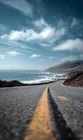 Coastal highway stretches into the distance beneath a sky filled with dynamic clouds and calming ocean vistas offering freedom and adventure photo