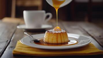 A dessert is being poured onto a plate with a cup of coffee photo