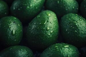Green avocados with water droplets photo